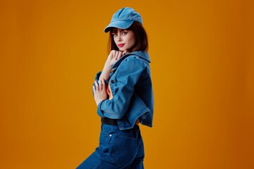 Beauty Fashion woman denim cap red lips glamor fashion yellow background unaltered