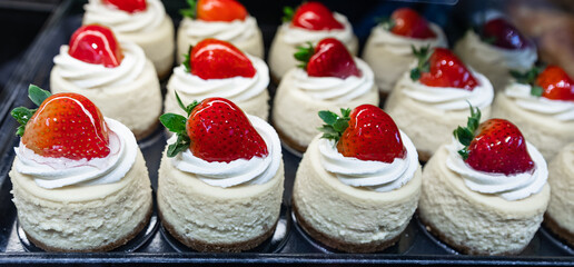 Cake displayed in shop window of confectionery or cafe. Fresh pastries on display on a confectionery stall