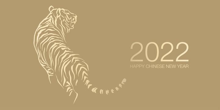 Happy Chinese New Year 2022 by gold brush stroke abstract paint of the tiger isolated on golden background