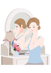 ドレッサーの前に座る女性