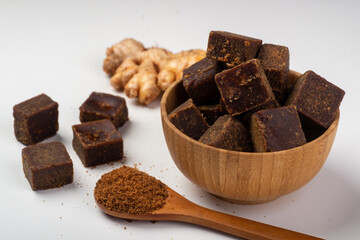 Lumpy brown sugar on a white background