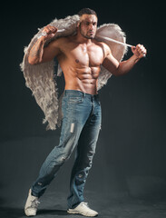 Handsome muscular, naked male angel with wings. Sexy athlete angel man. Valentines day.