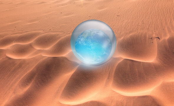 Global Warming Concept - Crystall Ball On The San Dune With Glass Globe (Planet Earth) 