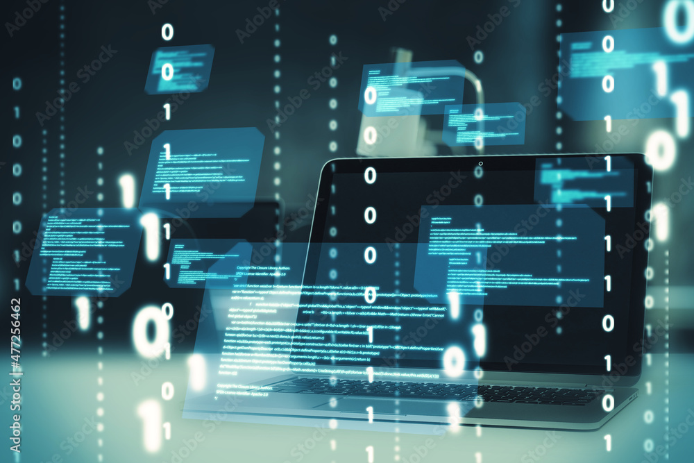Leinwandbilder Close up of desktop with laptop computer and abstract coding binary code hologram on blurry background. Artificial intelligence and development concept. Double exposure.