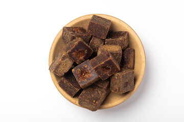 Lumpy brown sugar on a white background