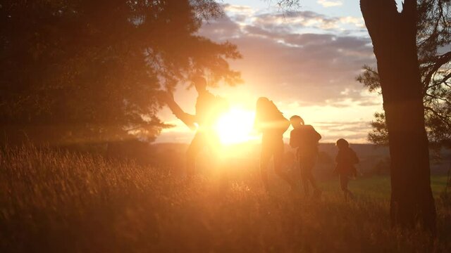 hiker group. team of hikers with backpacks silhouette walk through the forest. nature travel a adventure concept. hiker group with backpacks lifestyle walk on the sunset. mountain outdoor view