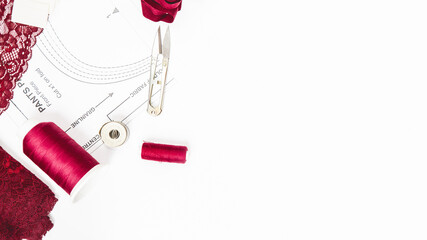 Woman hobby. Set for tailor shop with scissors, sewing tools, burgundy lace fabric on white background top view