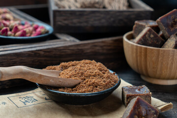 Lumpy brown sugar on a white background