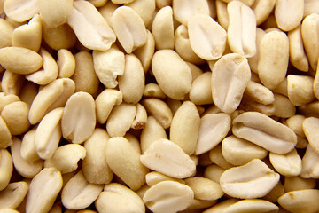 Raw blanched peanuts as food background