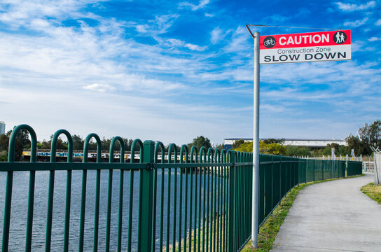 Caution Sign For A Bicycle Rider To Slow Down In The Construction Area.