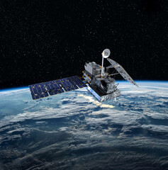 Naklejka premium Cargo space craft and Earth planet. Dark background. Sci-fi wallpaper.Space Station Orbiting Earth.Space ship. Space art wallpaper.Solar Observatory.Elements of this image furnished by NASA.