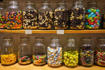 colorful candies in a glass jar 