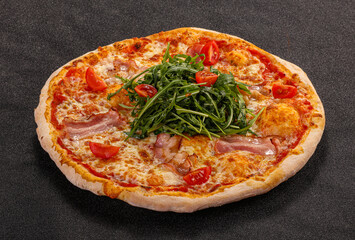 Pizza with bacon and rucola
