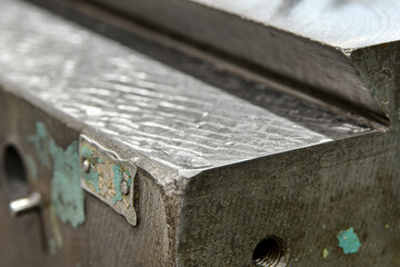 Machine bed guides after scraping and finishing with a scraper. Repair and maintenance of metal-working machines.