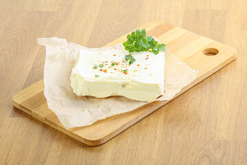 Greek Feta cheese over board