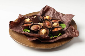 Concept of sweets with chocolate candies on white background