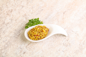 Grain mustard sauce in the bowl