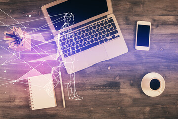 Start up theme drawing over computer on the desktop background. Top view. Double exposure....