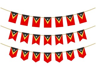 East Timor flag on the ropes on white background. Set of Patriotic bunting flags. Bunting decoration of East Timor flag