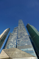 Obraz premium Skyscrapers in the business center, financial district, sunny day, blue sky, empty space, Moscow city, Russia.
