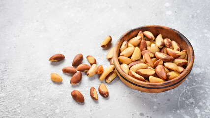 Nuts. Brazil nut on a stone background. Top view. Free space for text.