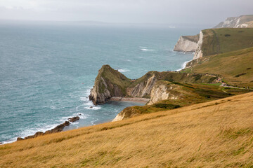 Man O'War beach near Durdle Door as seen from the coastal path from Lulworth Cove with Bat's Head in the distance.