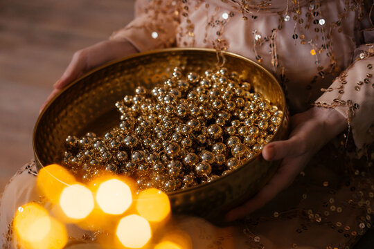 Gold beads in a gold platter