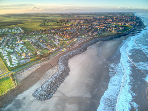 Aerial view of a UK seaside town showing boulder sea defences