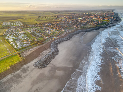 Aerial view of a UK seaside town showing boulder sea defences