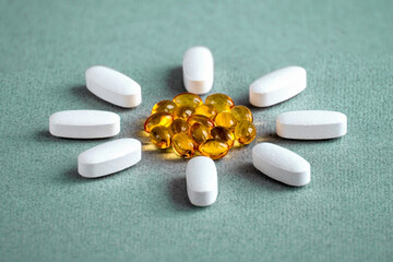 Vitamin D ( omega 3 ) tablets and capsules complex for the treatment and health of humans lined in...