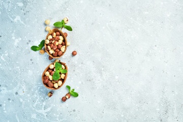 Walnut background. Hazelnuts on a stone background. Top view. Free space for text.