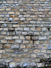 The texture of a natural stone wall. Background image