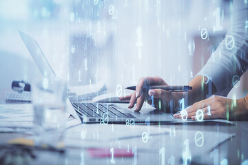 Double exposure of woman hands working on computer and data theme hologram drawing. Tech concept.