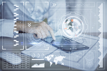 Double exposure of man's hand holding and using a digital device and data theme hologram drawing. Technology concept.