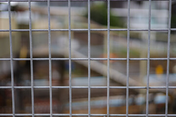 looking through a steel fence background blurred and fence in full focus Sydney NSW Australia