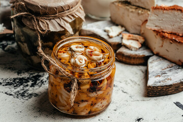 Jar with cheese marinated in oil. Ecology and eco-products, tasty and healthy food. handmade Cheese. banner, menu, recipe top view