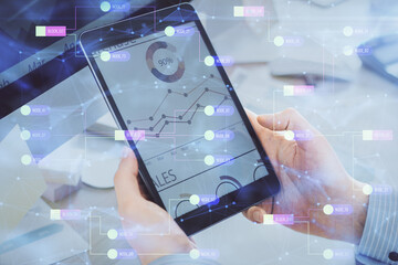 Multi exposure of man's hands holding and using a digital device and data theme drawing. Innovation concept.