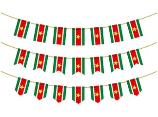 Obraz premium Suriname flag on the ropes on white background. Set of Patriotic bunting flags. Bunting decoration of Suriname flag
