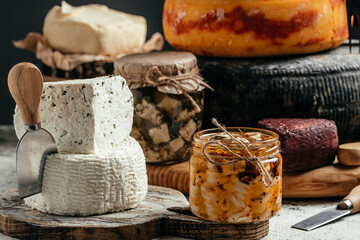 Various dairy products. jar with cheese marinated in oil. Ecology and eco-products, tasty and healthy food. banner, menu, recipe