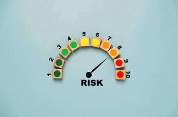 Risk level indicator rating print screen wooden cube block since low to high on blue background for Risk management and assessment concept.