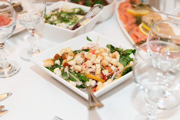 Fototapeta na wymiar Caesar salad on a set table