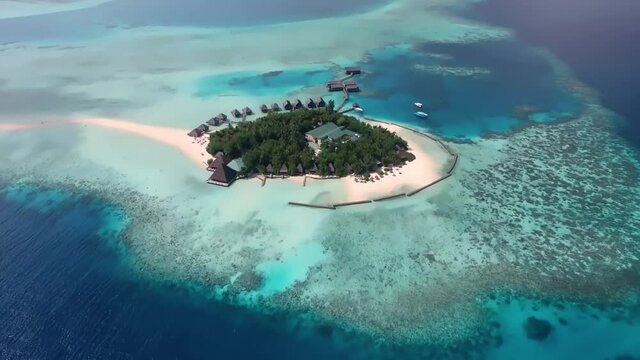 Beautiful top view of maldives, tropical island, lagoon. Natural summer landscape. Flight with drone