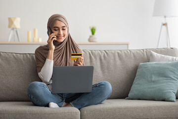 Naklejka premium Online payment at home. Successful woman doing online shopping using computer