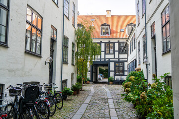 Copenhagen, Denmark - October 1, 2021: Interior courtyard between houses along a central street in Copenhagen