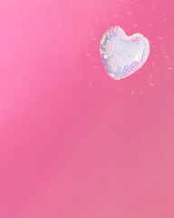 disco heart flying.love concept design.aesthetic heart design on a vibrant pink background.valentine holidays idea.happy festive celebration