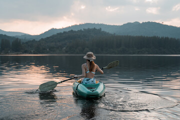 Kayaks in the lake. Tourists kayaking on mirror lake. taking photo when travel activity. woman...