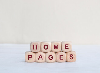 HOME PAGES concept. Wooden blocks with text on table. Copy space