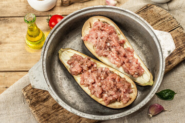 Stuffed eggplant ready to bake with ground meat, vegetables, and spices