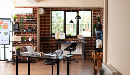 Nobody in business office with desks and modern equipment, used to plan startup project. Empty space with technology and furniture, decorations for financial meeting in boardroom.