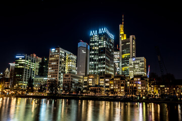Obraz na płótnie Canvas The skyline of Frankfurt - Main at night at a cold day in winter.